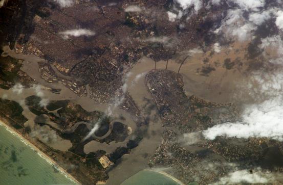 Lagos © NASA/JSC - Badagry Creek flowing in from the left of the image, and the edge of the lagoon on the right, joining to flow into the Atlantic at the bottom.