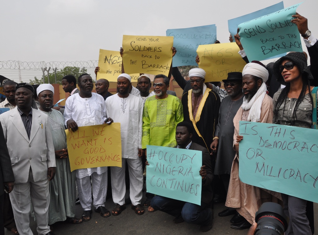 Protesters carrying placard led by Dr. Tunji Brathwaithe protesting at Alausa Ikeja the presence of Military men in Lagos road