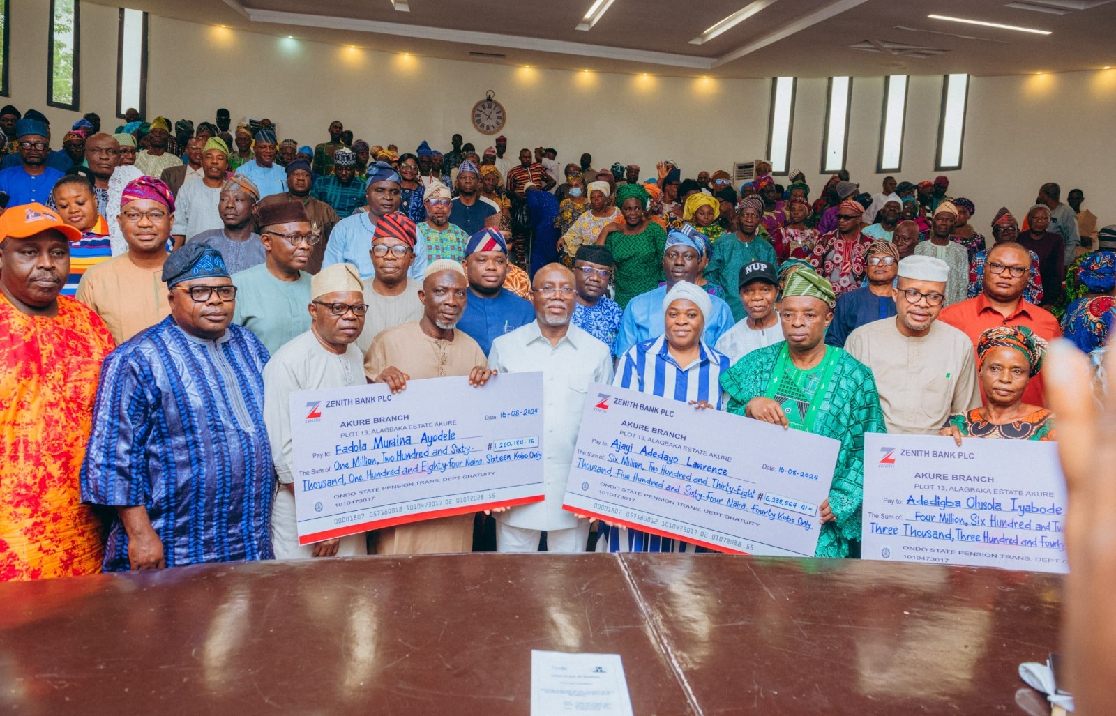 Gov Aiyedatiwa of Ondo State present checks to retirees